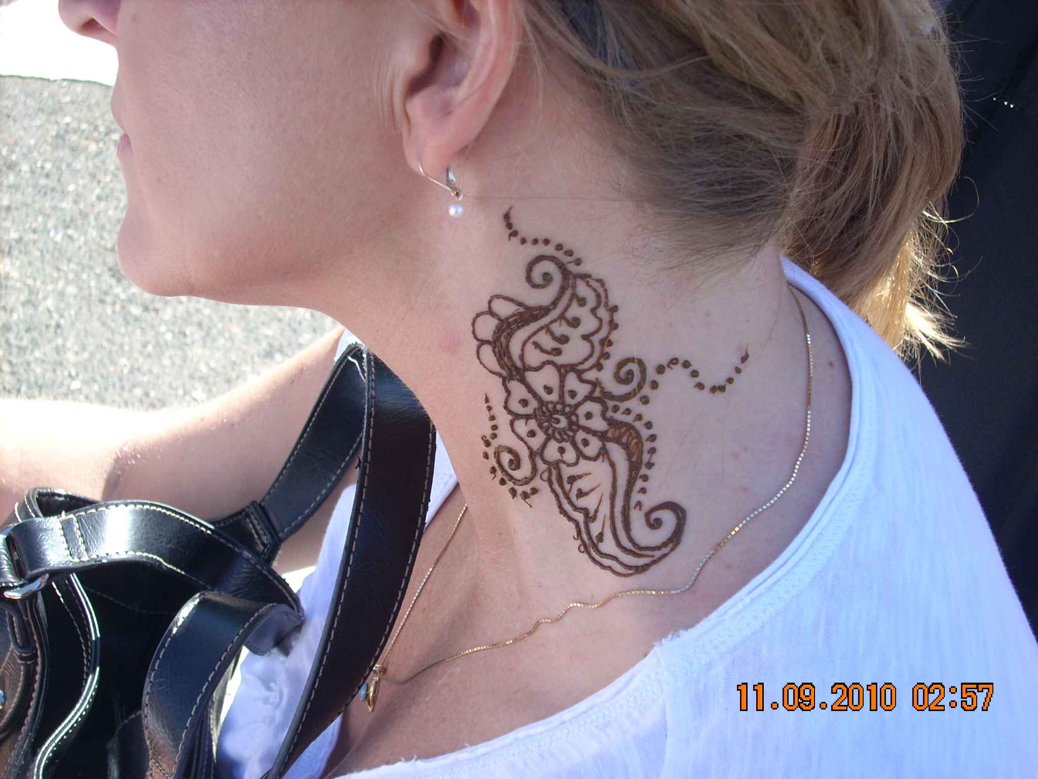 henna-flower-tattoo-on-neck-for-women