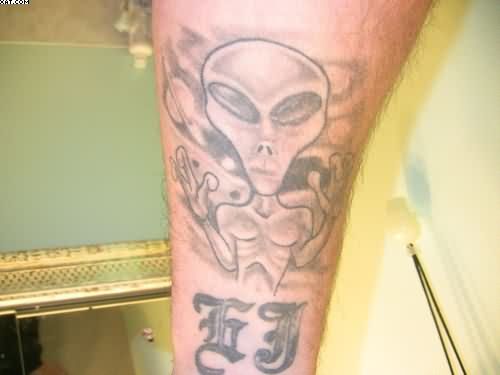 Grey Ink Alien Tattoo Design