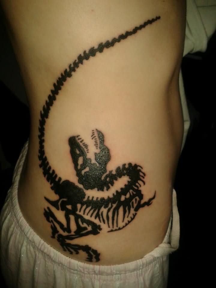 Ink Dinosaur Skeleton Tattoo on Rib